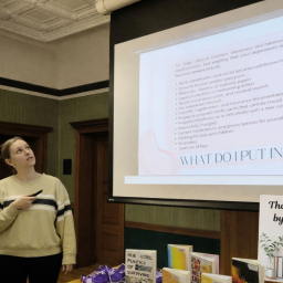 A presenter points at a powerpoint on creating a go bag