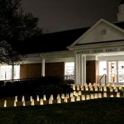 Front of the library with lanterns on the path and stairs