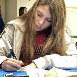 Teen hangout particpant makes a canvas magnet for her locker