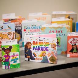 Image shows the covers of diverse books facing forward on top of a table