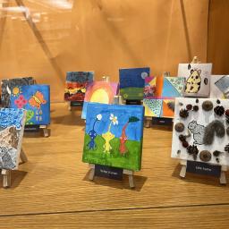 Tiny art canvases displayed at the Arlington Heights Memorial Library