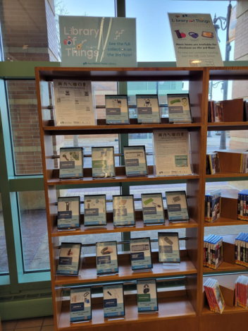 Library of Things bookshelves with assistive technologies displayed