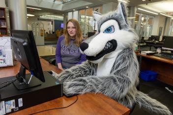 Wiley the Wolf and Library at Reference Desk