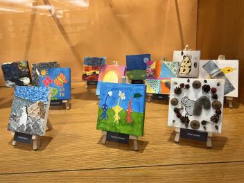 Tiny art canvases displayed at the Arlington Heights Memorial Library