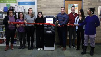 Library Trustees ribbon cutting ceremony for new ATM at the library.