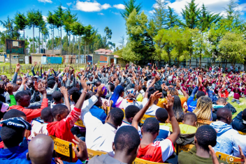 Students in Kinangop, Kenya excitedly wait for books from the Friends of the Joliet Public Library