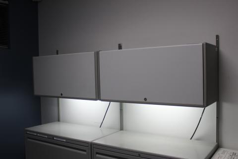 overhead cabinets with lights on
