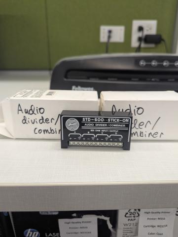 Black audio divider with a white box 