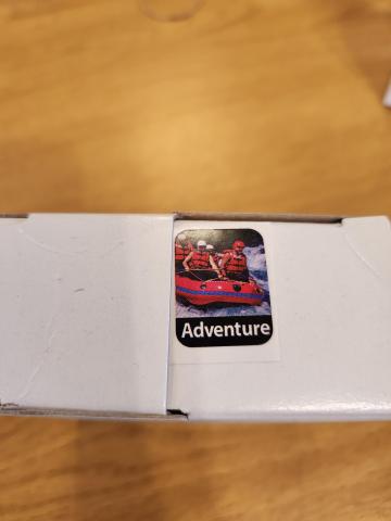 Genre stickers with ADVENTURE and people rafting