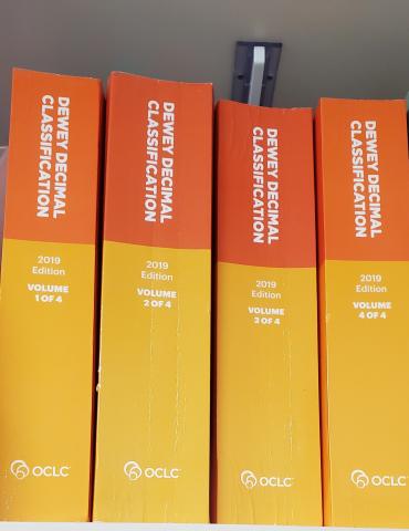 Four volumes of the Complete Dewey Decimal Classification 2019 edition.