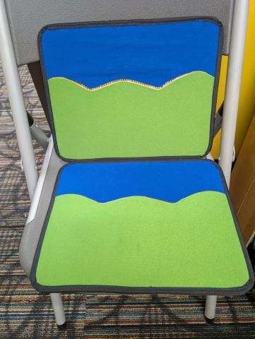 Two green and blue, black trimmed, boards meant for flannel stories.