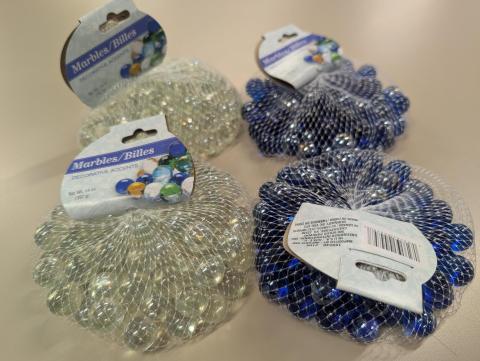 4 bags of decorative marbles - two clear and two blue