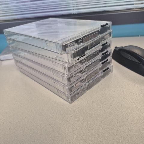 DVD security cases and unlocking device