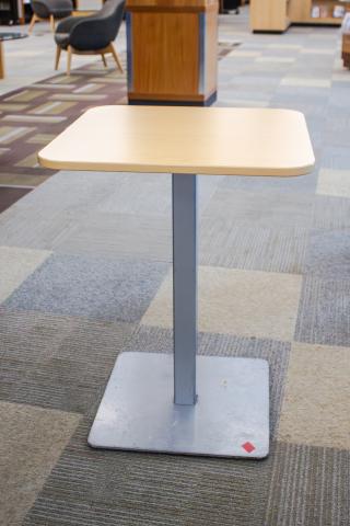 Metal pedestal base wood top tables