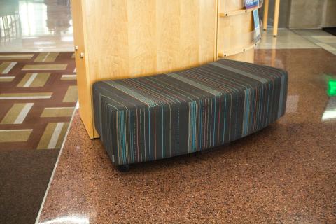 Curved black and colorful striped seat bench
