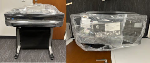 Large printer wrapped for moving with a collection of ink boxes on top.