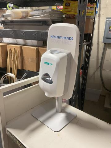 Hand sanitizer dispenser