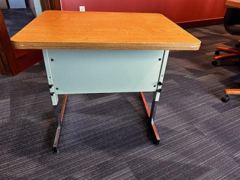 Single desk with metal legs and modesty panel and laminate top. 