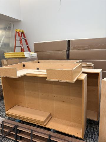picture of wood bookshelf and base with other shelves in background