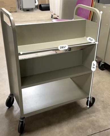 Image is of a push cart with 2 levels of shelving and a bottom platform