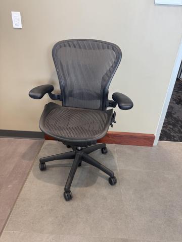 photo of one rolling office chair, black. 