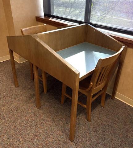 Study carrel with seats facing each other and two chairs.