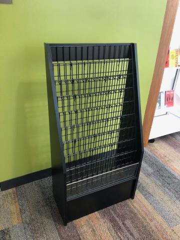 black wire shelf with short plexiglass along front