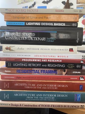 A stack of books with their spines visible.
