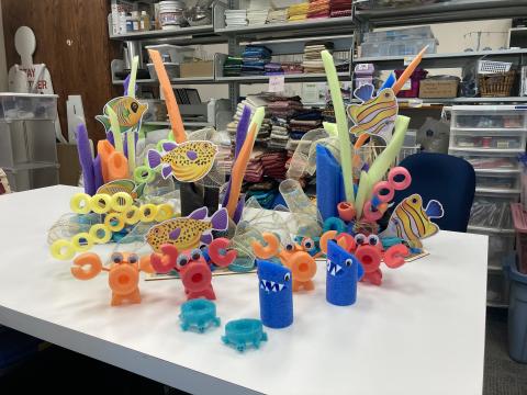 3 Large coral fish displays and many tiny creatures, all made of pool noodles. 