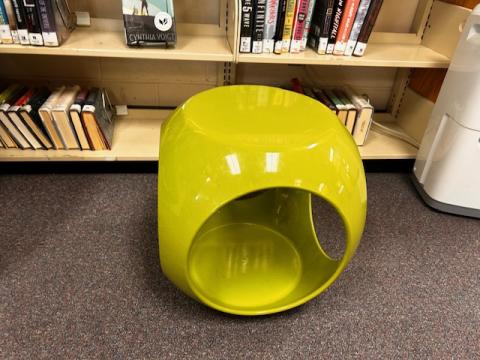 Hollow cube-shaped light green ottoman