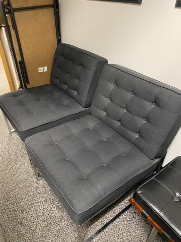 2 black office lounge chairs