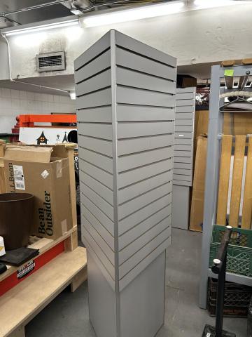 gray triangular slatwall unit