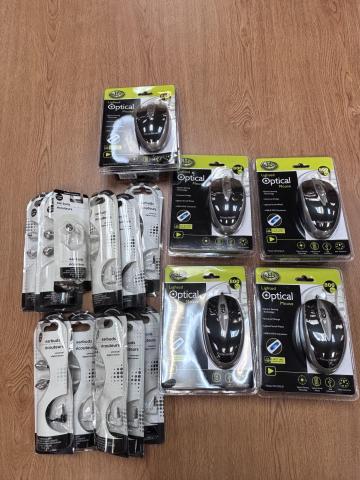 Photograph of numerous computer mice and earbuds, still in their plastic cases.