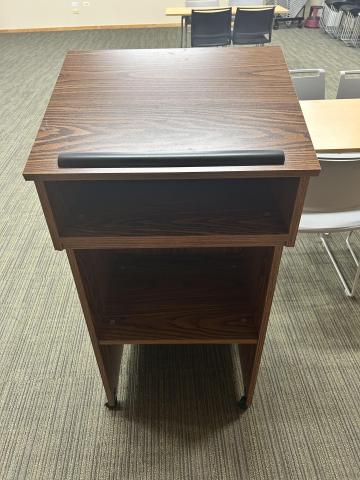 brown podium with inside shelf