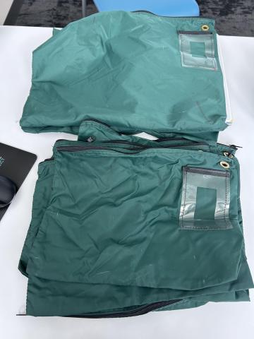 sturdy zippered pouches for mailing bags to home service patrons. Bags have a pouch for mailing information and zipper/grommet to secure closed with zip tie. There are 8 bags total.
