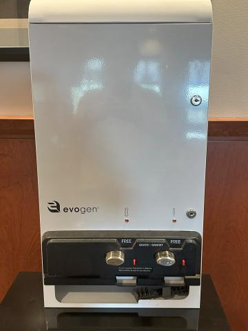 White tampon pad/dispenser