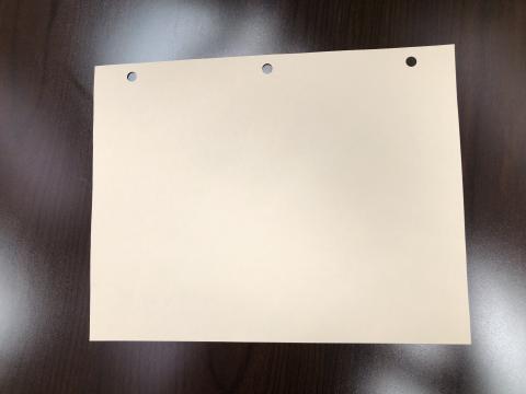tan sheet of paper on table