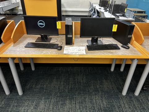 wide laminate top table with privacy screen and divider holding two computers