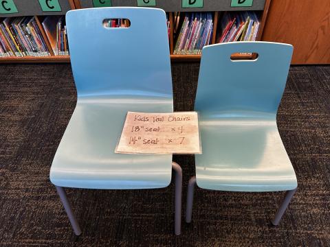 two teal chairs for children; one chair is slightly taller then the other