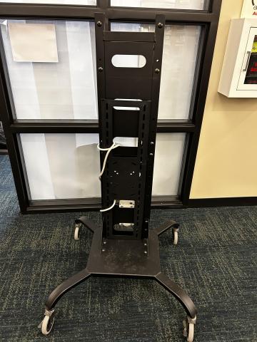 black metal frame cart for holding a mounted flatscreen tv