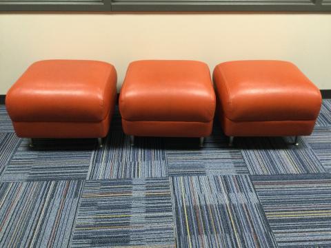 photo of 3 orange footrests