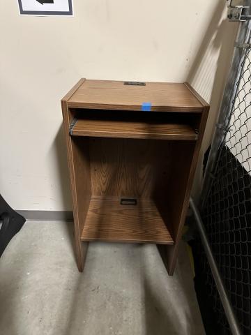 A plain wooden podium 