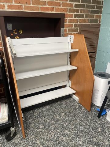 Freestanding bookshelf with 3 shelves 9 inch deep. Unit sides extend in front of shelves up to 25 inch total depth.
