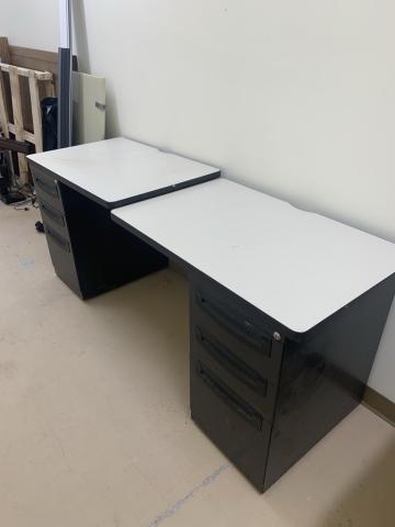 Desk with end drawers at either end. Top portion is not connected in the middle.
