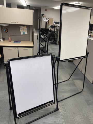 Picture of two whiteboards one is at easel height the other is A-frame height