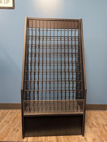 A black tiered magazine rack 