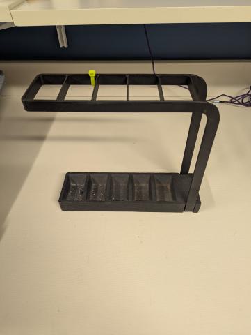 A black metal umbrella stand 