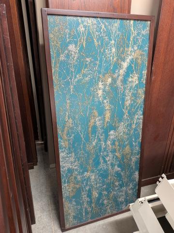 Example of 54 inch shelving end panel with small beige flower stems on a blue-green background.