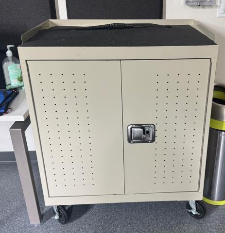 beige metal cabinet on wheels