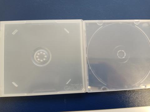 Two white plastic disc cases on a dark blue background